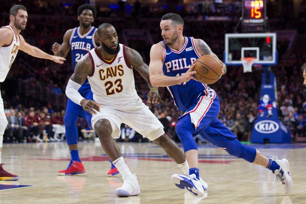 JJ Redick of the Philadelphia 76ers drives to the basket against LeBron James of the Cleveland Cavaliers at the Wells Fargo Center on November 27, 2017 in Philadelphia, Pennsylvania. (Getty Images)