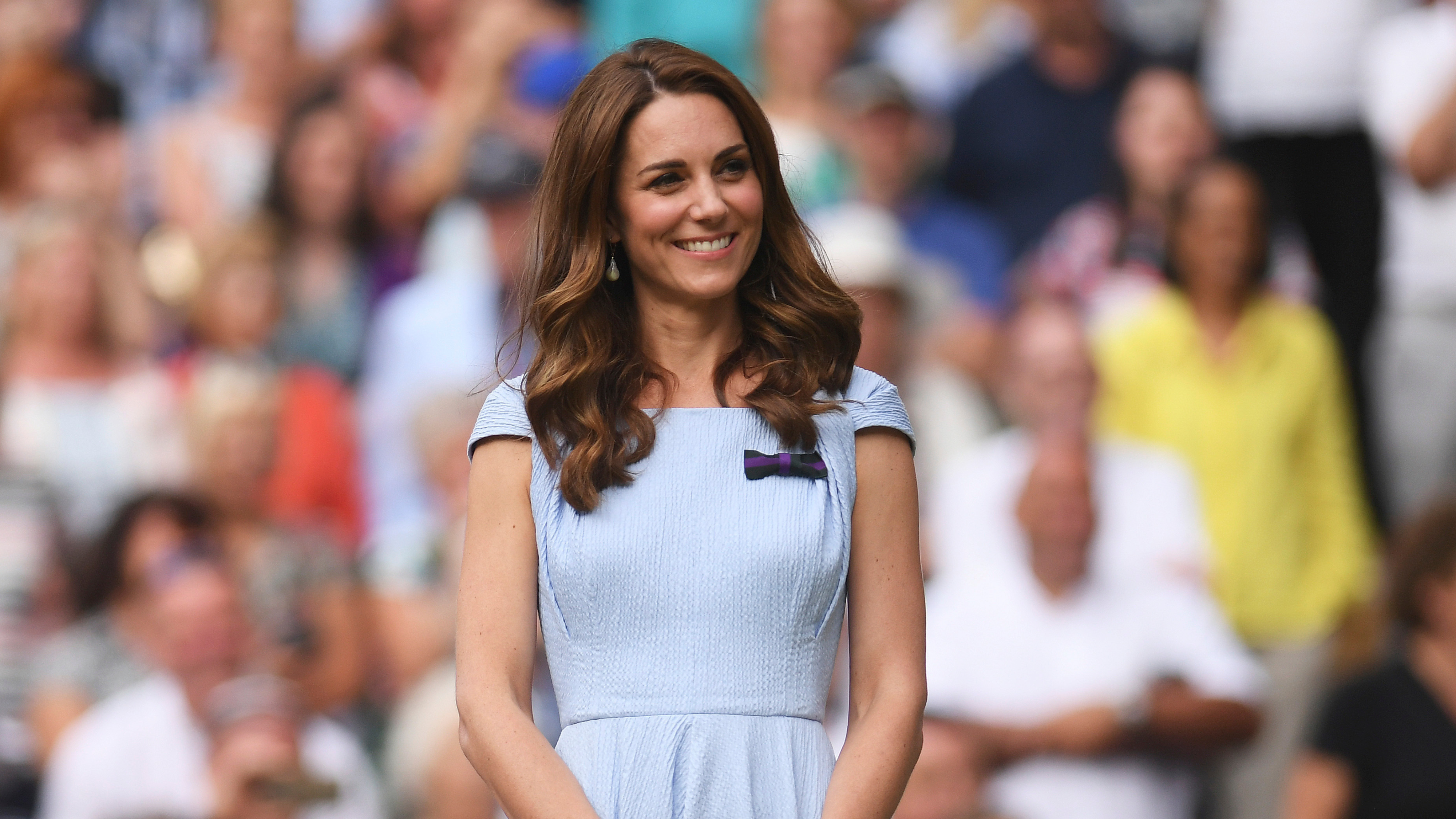 Britain's Kate, Duchess of Cambridge stands on centre court during the trophy presentation of the Wimbledon Tennis Championships in London, Sunday, July 14, 2019.